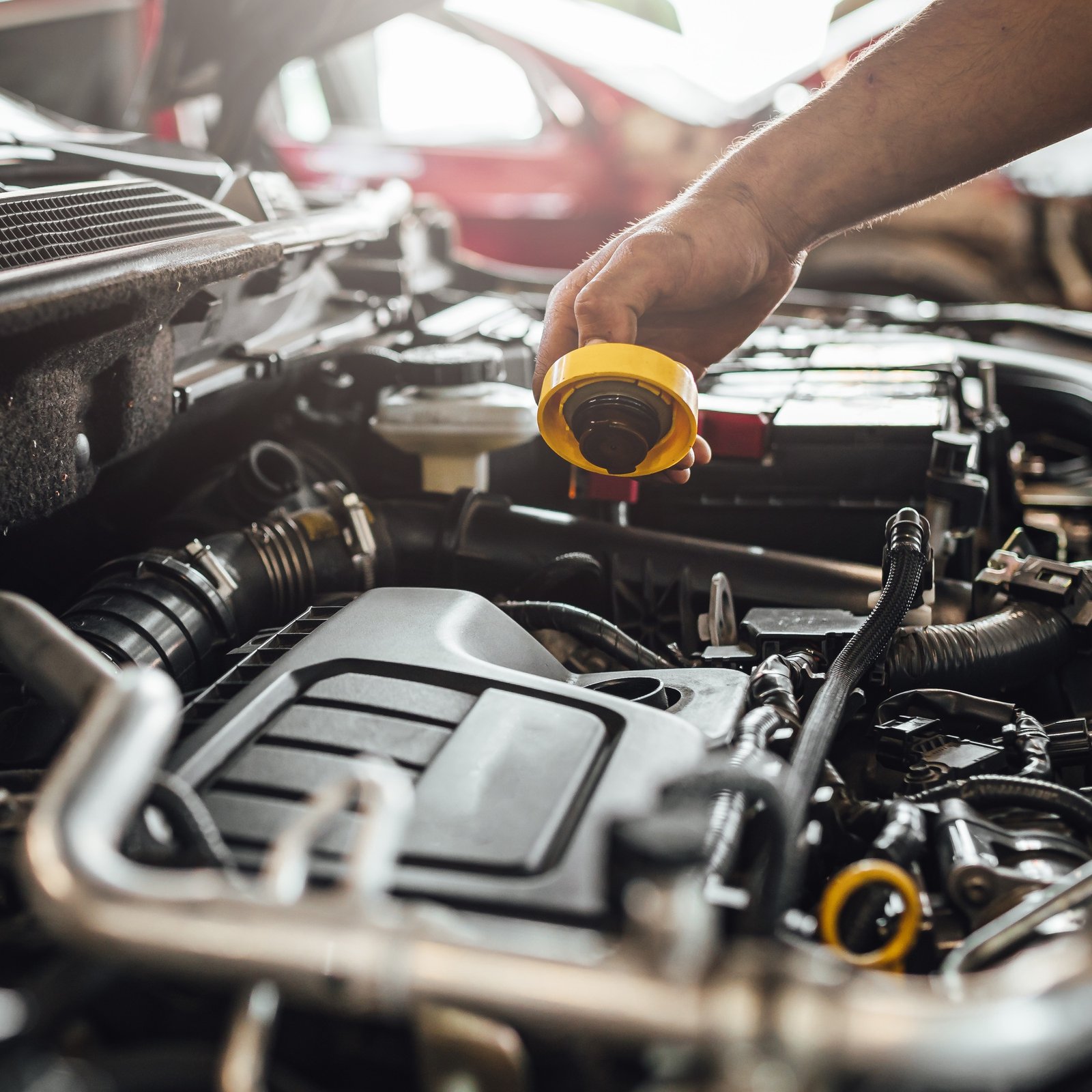 Closeup shot of auto mechanic hands doing car technical inspection in service