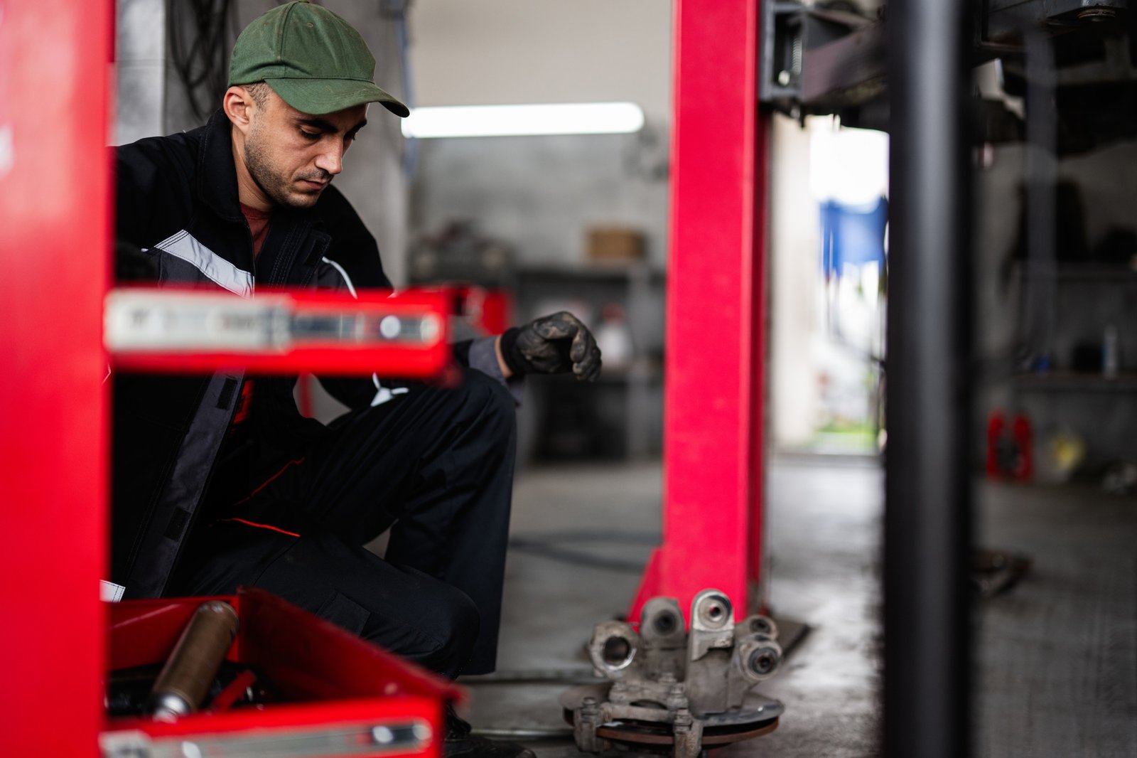 Mechanic working in auto repair shop with focus and dedication
